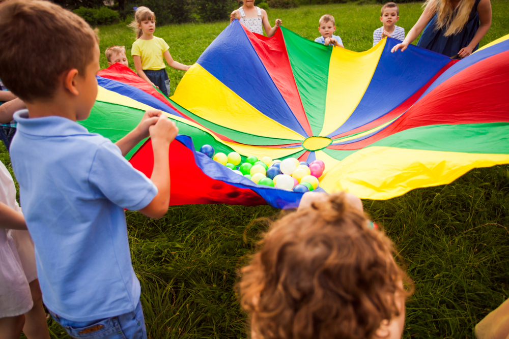 Children playing a parachute game