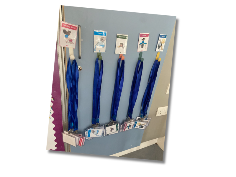 Play activity lanyards on wall hangers